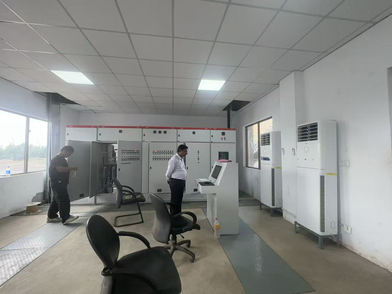 Project team in the textile mill heater control room