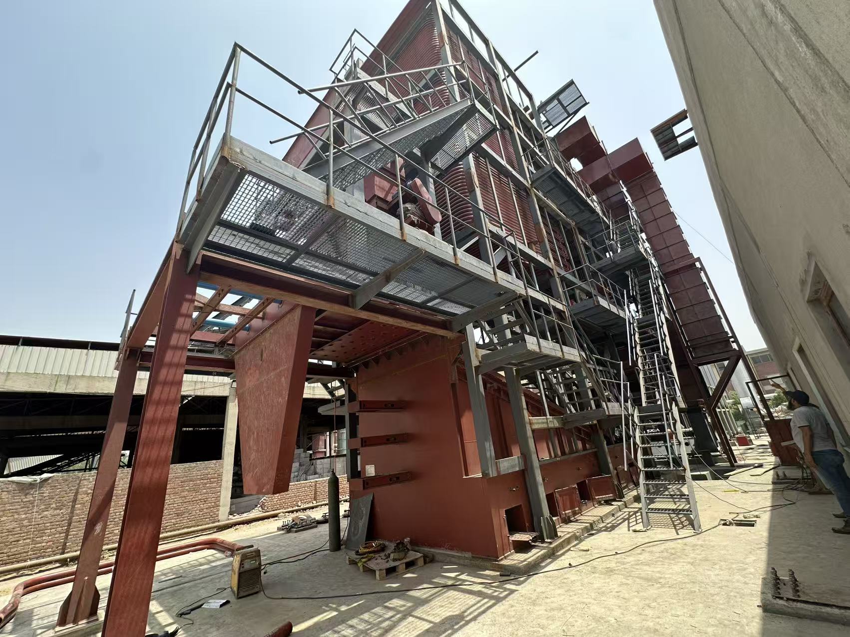 Vertical thermal oil heater structure and platforms during installation in Pakistan