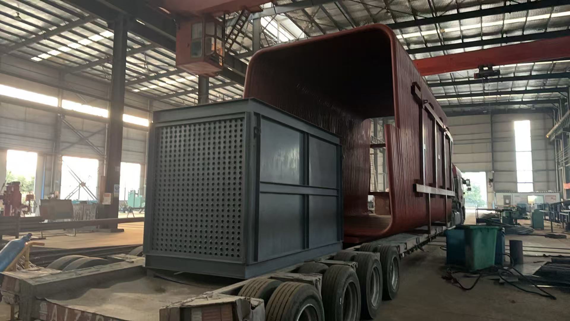 Large thermal oil heater component loaded onto a trailer inside Huayuan workshop